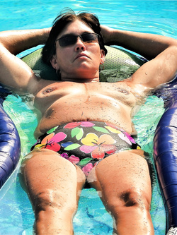 Mature wife naked in the pool