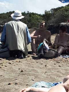 On a nudist beach